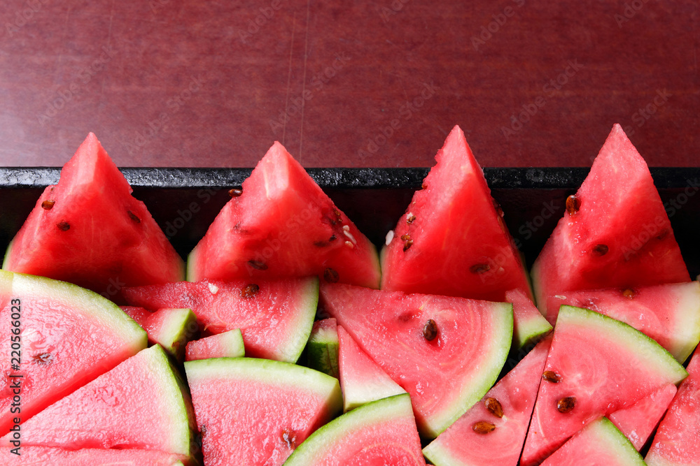 Watermelon slices. Pieces of ripe watermelon in old metal dishes. Red fruit with fructose for a diet. Cleansing the body with a diuretic meal. Vegetables for vegan Watermelon slices. Pieces of ripe watermelon in old metal dishes. Red fruit with fructose for a diet. Cleansing the body with a diuretic meal. Vegetables for vegan