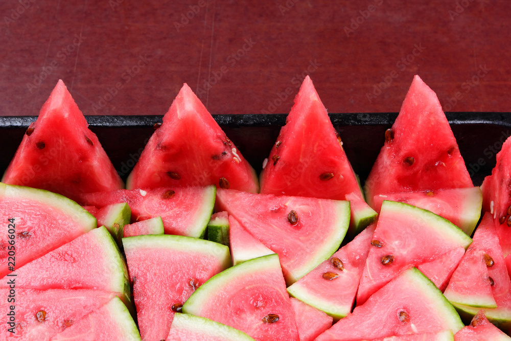 Watermelon slices. Pieces of ripe watermelon in old metal dishes. Red fruit with fructose for a diet. Cleansing the body with a diuretic meal. Vegetables for vegan Watermelon slices. Pieces of ripe watermelon in old metal dishes. Red fruit with fructose for a diet. Cleansing the body with a diuretic meal. Vegetables for vegan