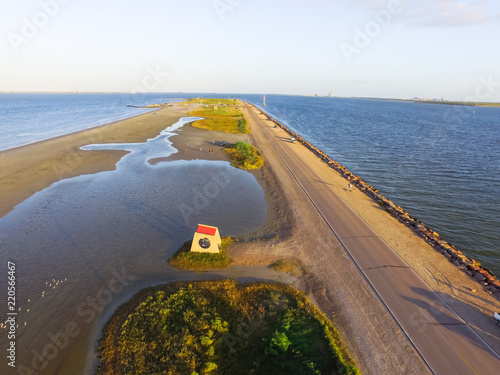 Aerial view famous Texas City Dike, a levee that projects nearly 5miles south-east into mouth of Galveston Bay. It was designed to reduce the impact of sediment accumulation along the lower Bay photo