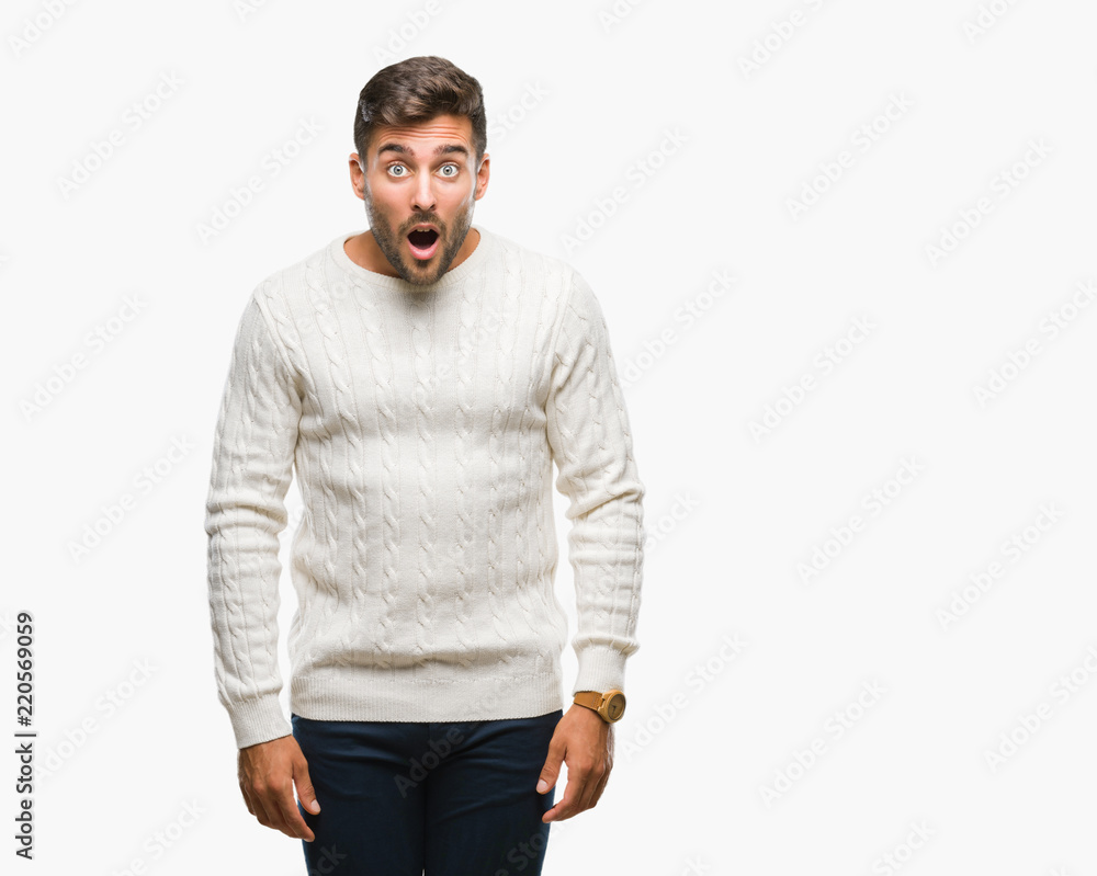 Young handsome man wearing winter sweater over isolated background afraid and shocked with surprise expression, fear and excited face. Young handsome man wearing winter sweater over isolated background afraid and shocked with surprise expression, fear and excited face.