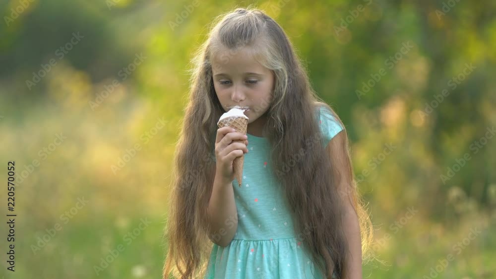 the girl is eating ice cream the girl is eating ice cream