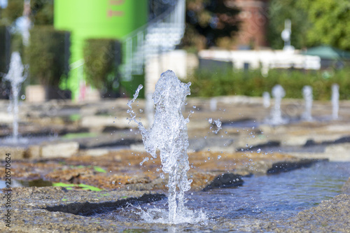 a water fountain springs in a park