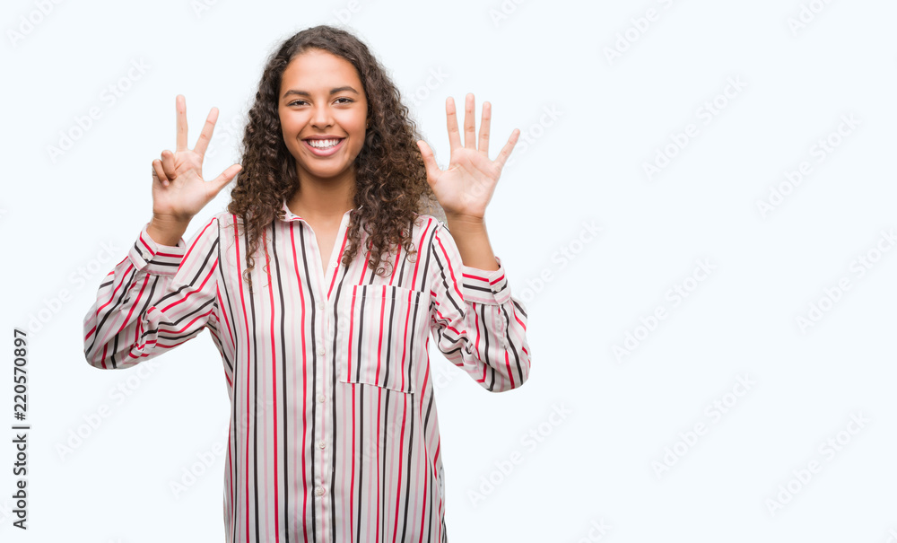 Beautiful young hispanic woman showing and pointing up with fingers number eight while smiling confident and happy. Beautiful young hispanic woman showing and pointing up with fingers number eight while smiling confident and happy.