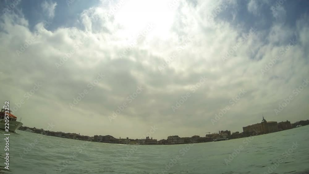Cloudy day skyline with boat traffic on Venice water channels. Time lapse view from Le Zattere Cloudy day skyline with boat traffic on Venice water channels. Time lapse view from Le Zattere