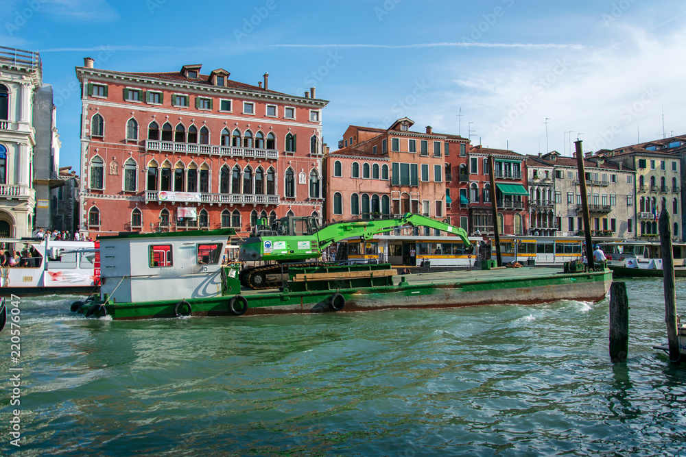 Industrial ship passing on the grand canal in Venice Italy 