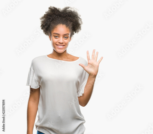Young afro american woman over isolated background showing and pointing up with fingers number five while smiling confident and happy.