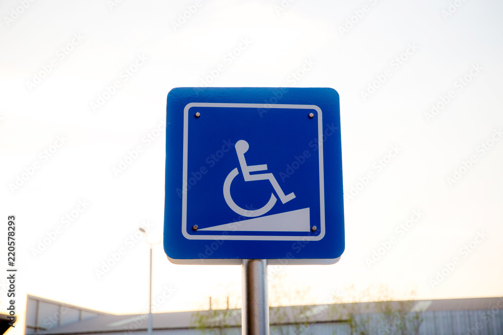 Blue label slope path for disabled person. priority car park for disabled person in the oil bank station. symbol of car park. image for objects, background, article and copy space. Blue label slope path for disabled person. priority car park for disabled person in the oil bank station. symbol of car park. image for objects, background, article and copy space.