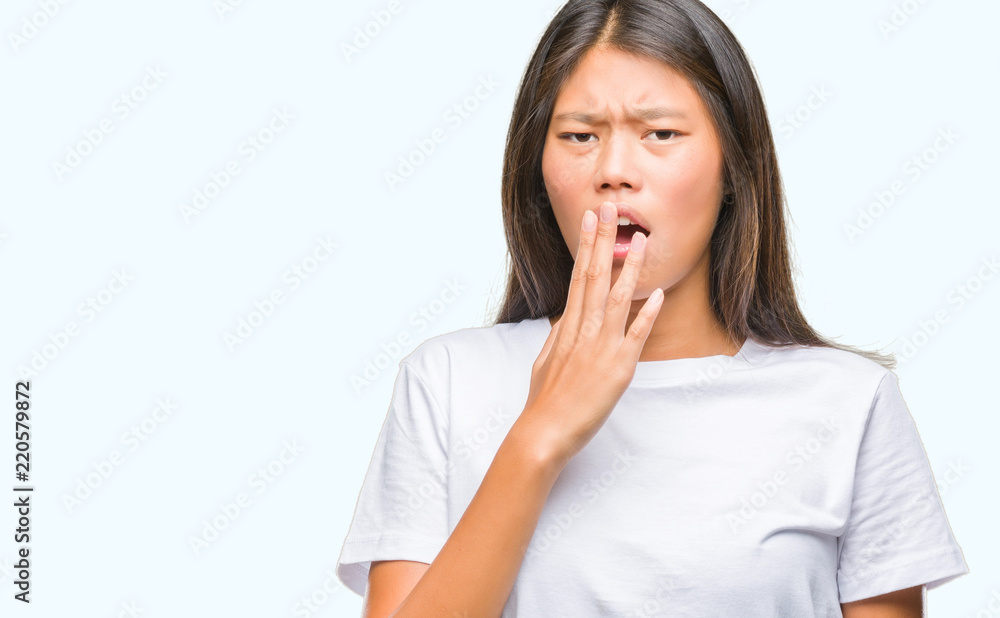 Young asian woman over isolated background bored yawning tired covering mouth with hand. Restless and sleepiness. Young asian woman over isolated background bored yawning tired covering mouth with hand. Restless and sleepiness.