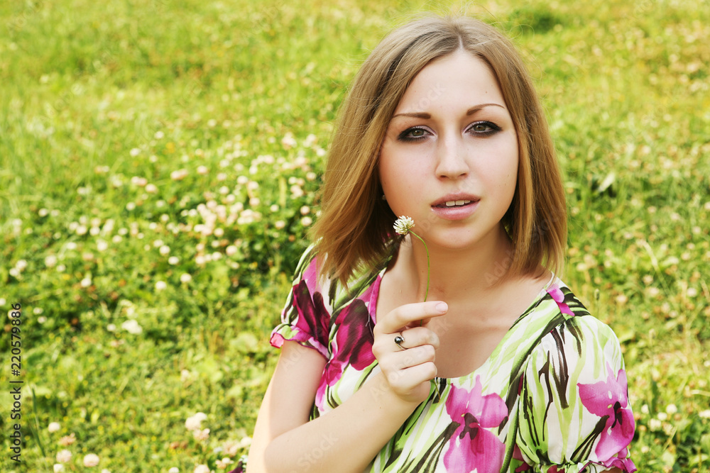 young woman relaxing in the grass young woman relaxing in the grass