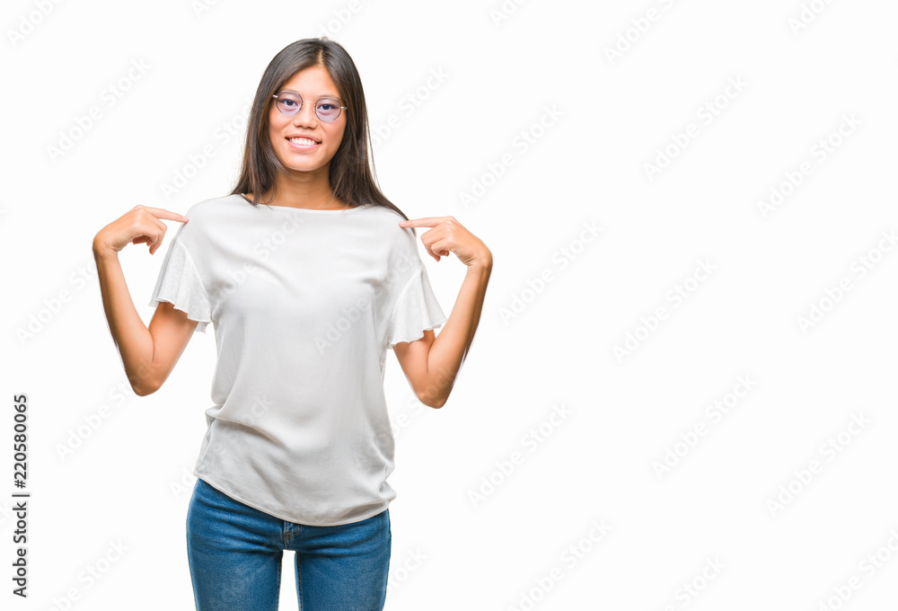 Young asian woman wearing glasses over isolated background looking confident with smile on face, pointing oneself with fingers proud and happy. Young asian woman wearing glasses over isolated background looking confident with smile on face, pointing oneself with fingers proud and happy.
