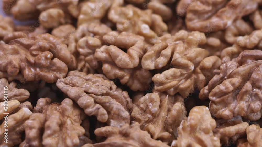 Walnut closeup. Rotating nuts background Walnut closeup. Rotating nuts background