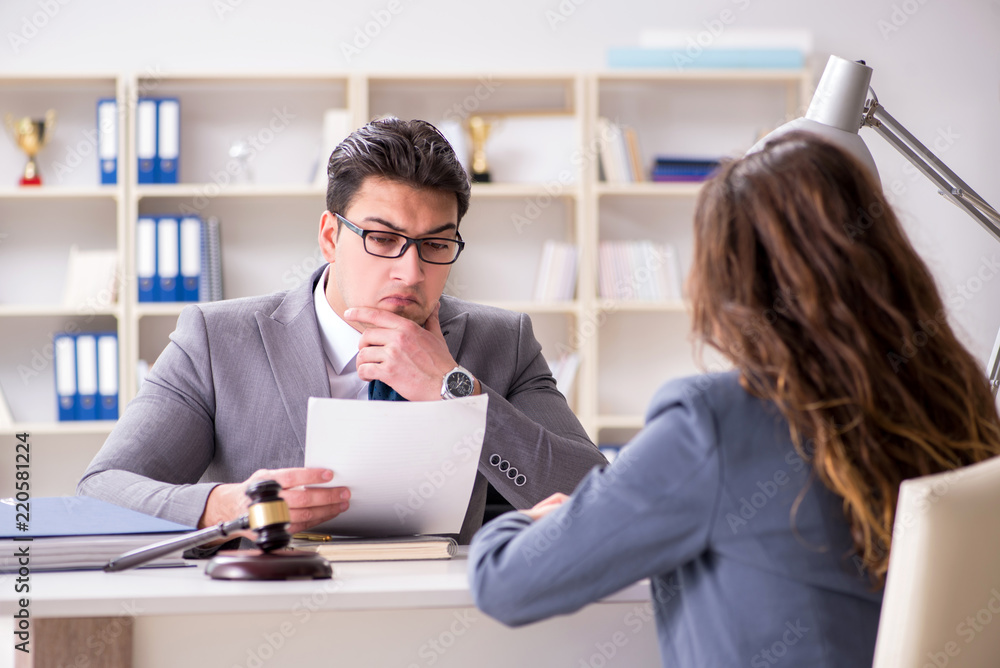 Lawyer discussing legal case with client Lawyer discussing legal case with client