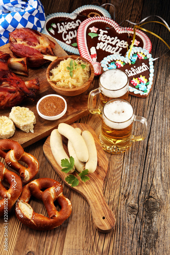 Traditional German cuisine, Schweinshaxe roasted ham hock. Beer, pretzels and various Bavarian specialties. Oktoberfest background