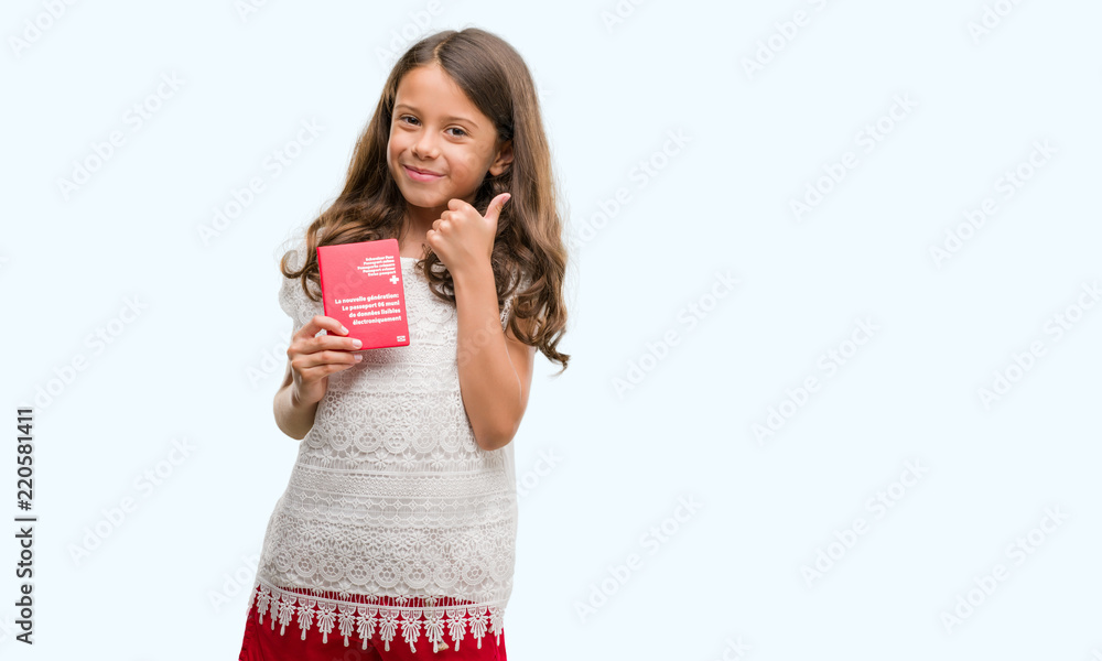 Brunette hispanic girl holding passport of Switzerland happy with big smile doing ok sign, thumb up with fingers, excellent sign Brunette hispanic girl holding passport of Switzerland happy with big smile doing ok sign, thumb up with fingers, excellent sign