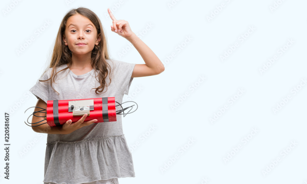 Brunette hispanic girl holding a bomb surprised with an idea or question pointing finger with happy face, number one Brunette hispanic girl holding a bomb surprised with an idea or question pointing finger with happy face, number one