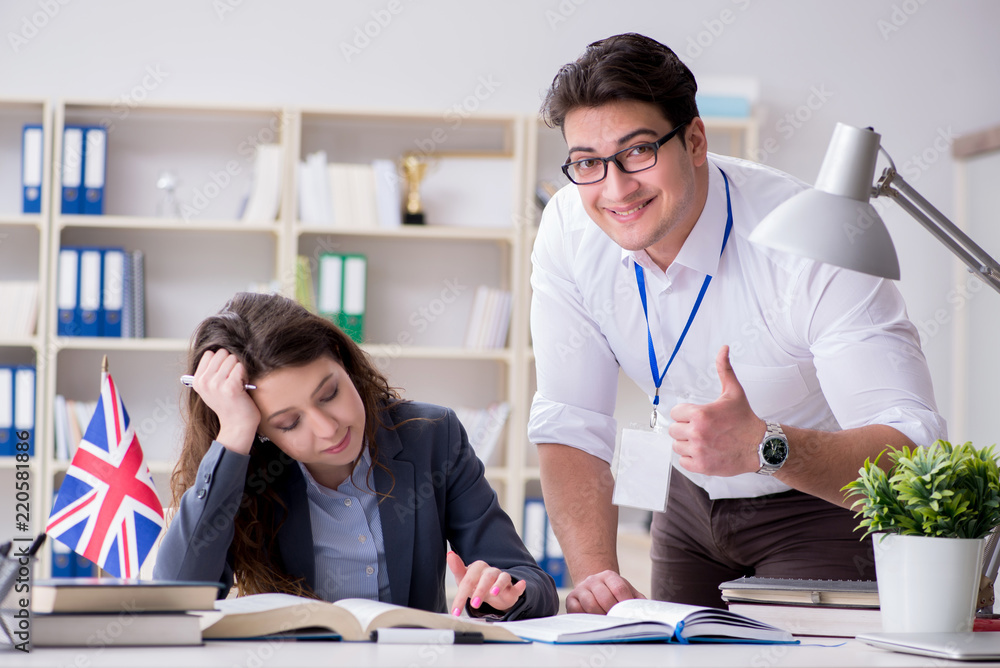 Teacher explaining to student at language training Teacher explaining to student at language training