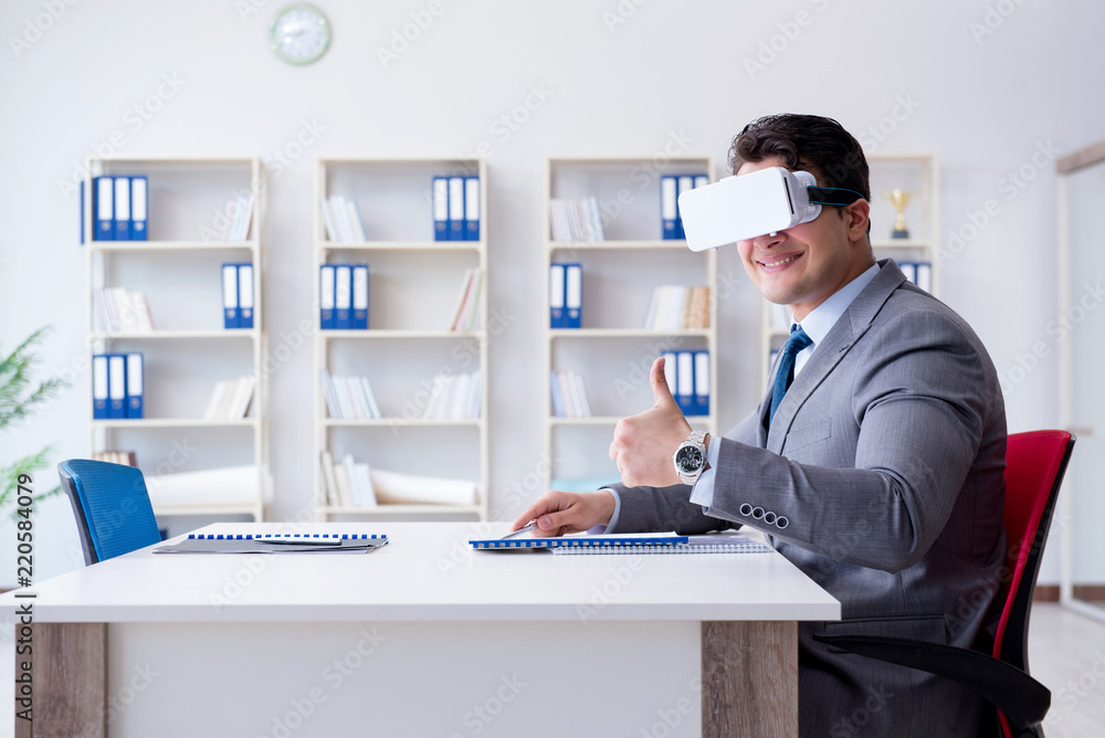 Businessman with virtual reality glasses in the office Businessman with virtual reality glasses in the office