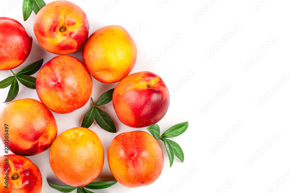 ripe nectarine with leaves isolated on white background with copy space for your text. Top view. Flat lay pattern ripe nectarine with leaves isolated on white background with copy space for your text. Top view. Flat lay pattern