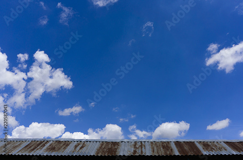 Roof of construction house with blue sky and cloud background.