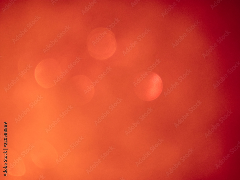 Blurred background lights. Abstract defocused gold, white, red and yellow glitters texture. Shining glowing effects