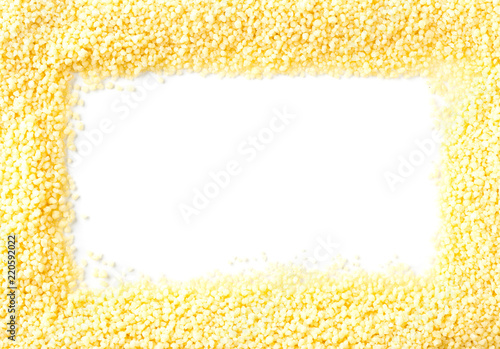 Heap of raw, uncooked couscous frame over white photo