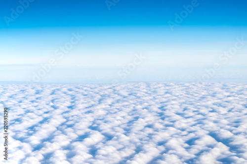 Blue sky and Cloud Top view from airplane window,Nature background.