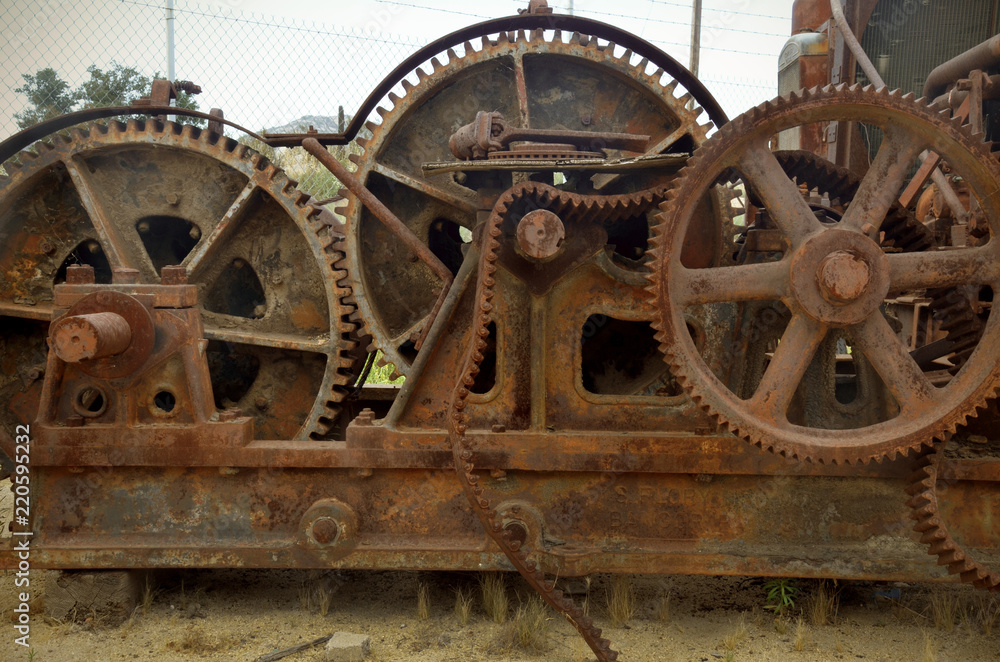 Gears and belt in rusty old machine