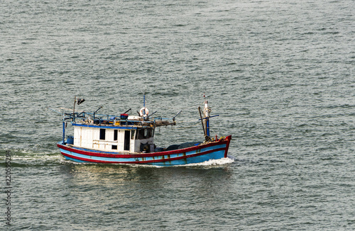 The fishing boat leaves on fishing