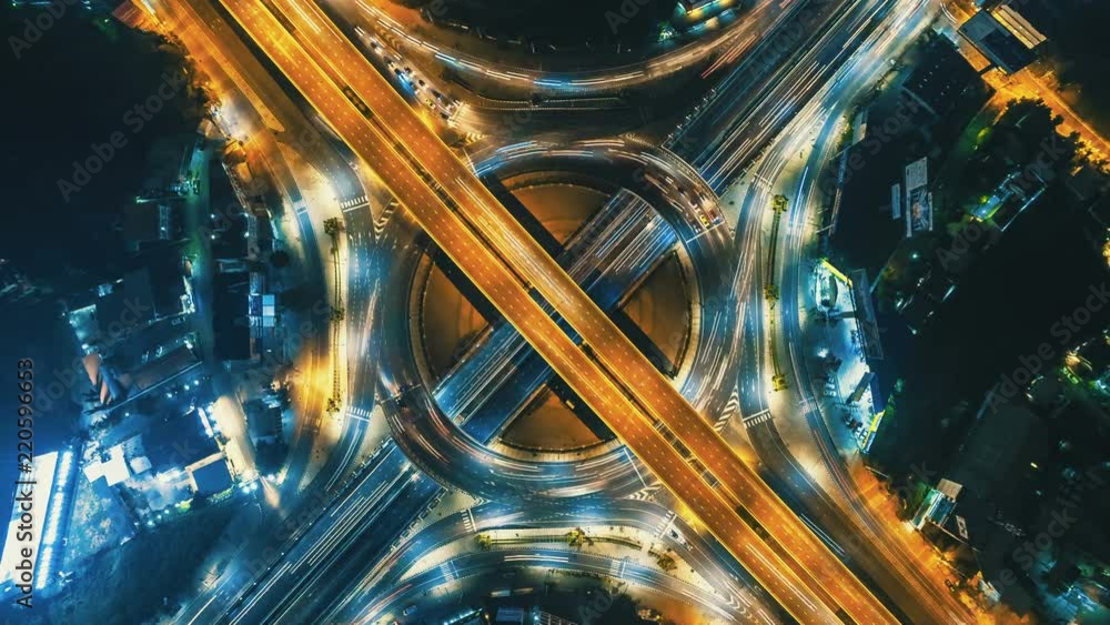 Hyperlapse timelapse of night city traffic on 4-way stop street ...