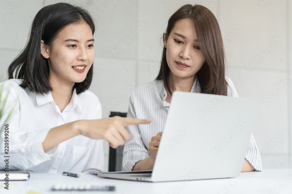 Business Woman teaching trainee employee in the office Business Woman teaching trainee employee in the office