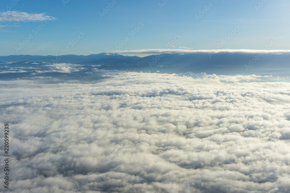 View of blue sky with cloud and city scape in plane window seen. View of blue sky with cloud and city scape in plane window seen.
