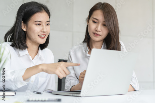 Business Woman teaching trainee employee in the office