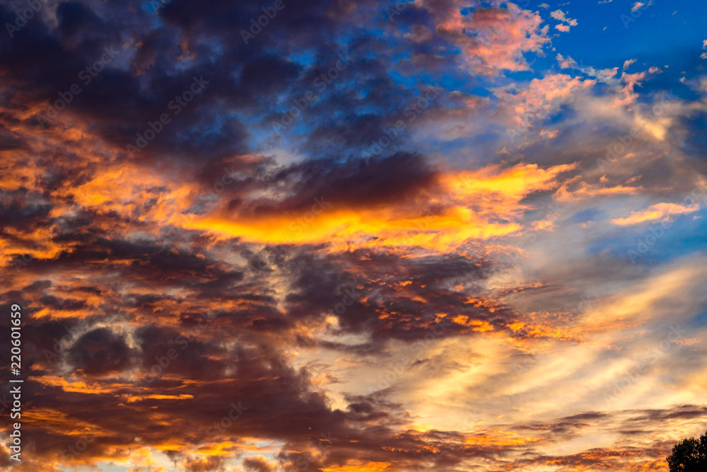 Fototapeta premium Bright beautiful sunset with clouds in summer