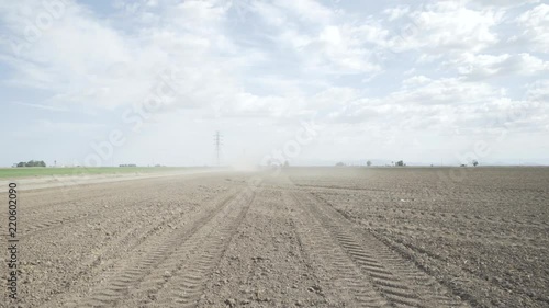 Tire tracks in leveled rural dirt field