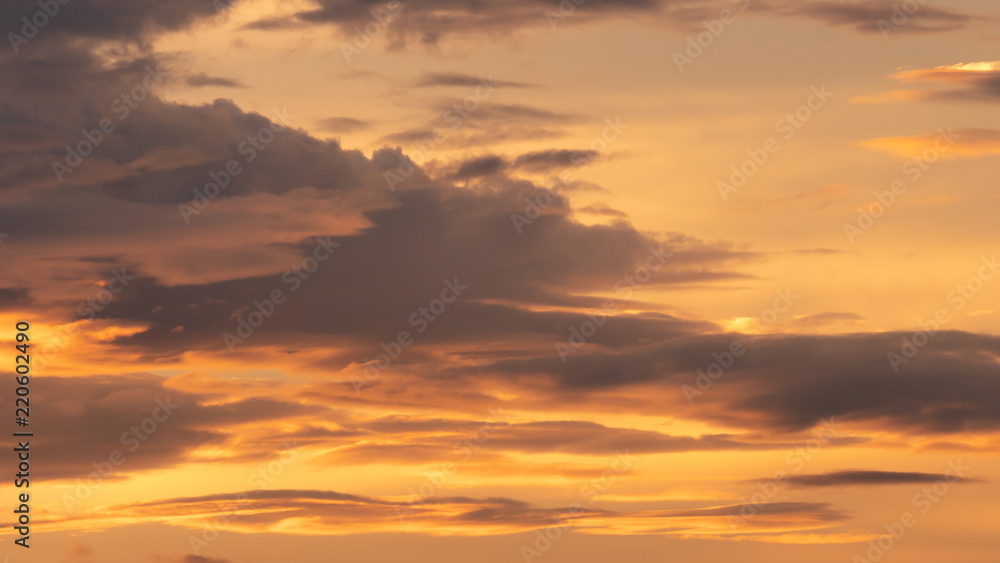 Sunsets, great yellow cloud in the bright of evening sun