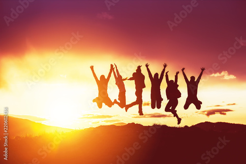 Happy friends silhouettes jumps sunset © cppzone