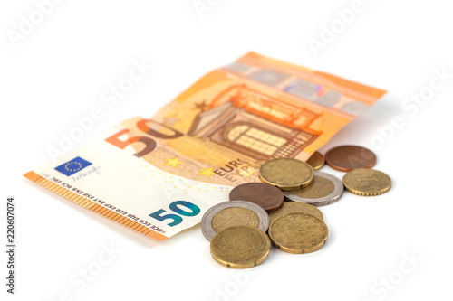 Stack of Euro banknotes and coins isolated. 50 Euro banknot