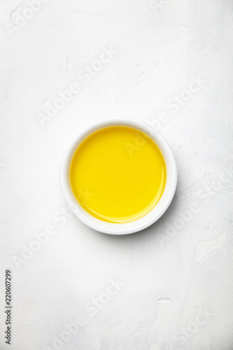 Olive oil on white stone background