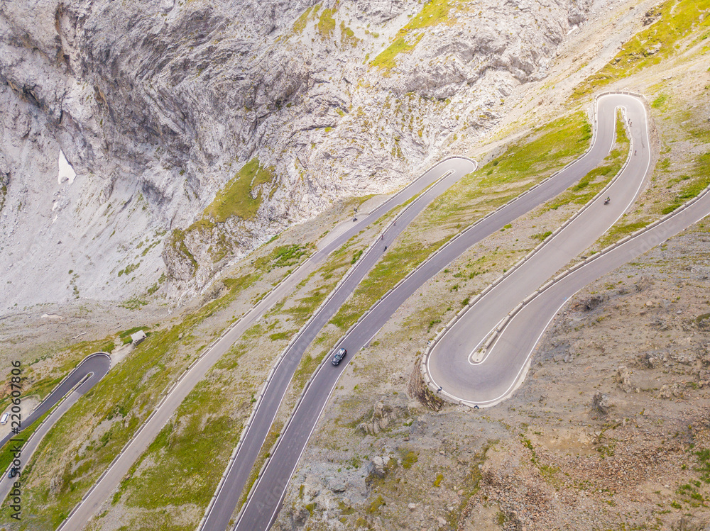 Road to the Stelvio mountain pass in Italy. Amazing aerial view of the mountain bends creating beautiful shapes