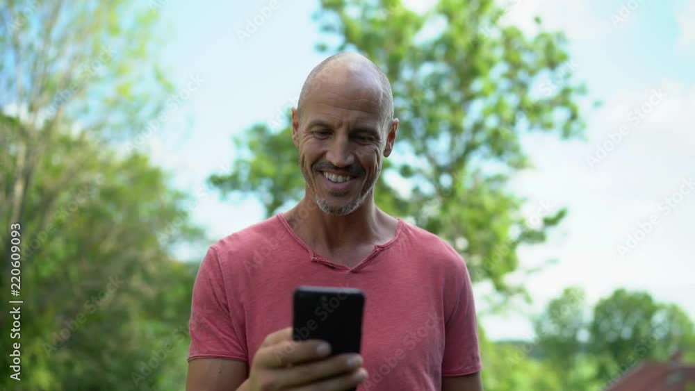 Young man smiling on phone Young man smiling on phone