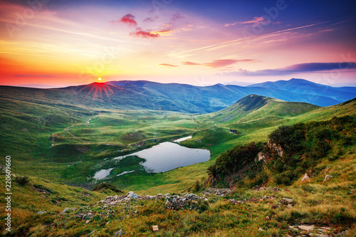 Captivating panoramic view on mountains. Incredible landscape photography, sunrise scene. Location: Svydovets mountain chain system in Ukrainian Carpathian mountains.