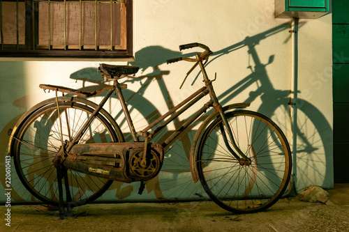 Taichung, Taiwan. 31-May-2018. Old rusted bicycle and its shadow against a wall