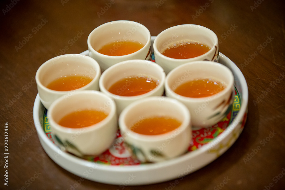 Tea set used in a Chinese wedding tea ceremony. Chinese wedding tea ceremony serving to elders.Chinese Tea ceremony is performed during a wedding or Chinese New Year. Tea set used in a Chinese wedding tea ceremony. Chinese wedding tea ceremony serving to elders.Chinese Tea ceremony is performed during a wedding or Chinese New Year.