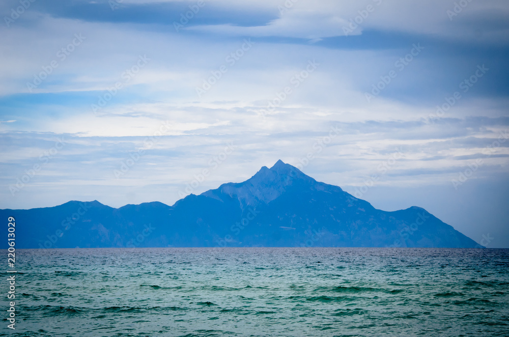 Mount Athos, mountain and peninsula in northeastern Greece, center of Eastern Orthodox monasticism, situated in the entire third, eastern and most beautiful peninsula of Halkidiki on rainy day