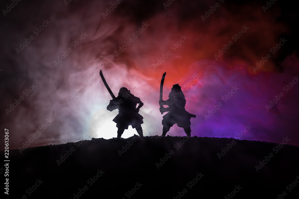 Silhouette of two samurais in duel. Picture with two samurais and