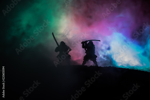 Silhouette of two samurais in duel. Picture with two samurais and sunset sky © zef art