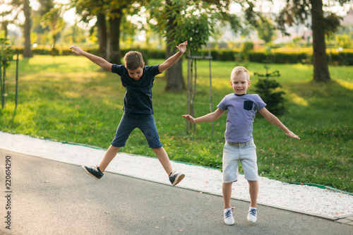 Boys have activity. Children run around and jumt up in the air © Aleksandr