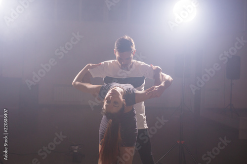 Active happy adults dancing bachata together in dance class