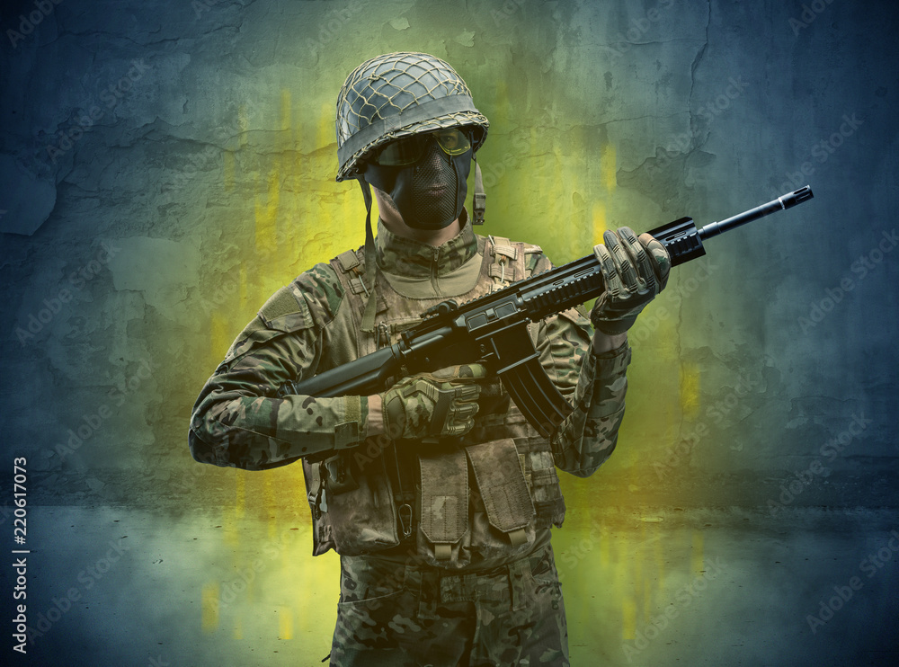 Hazard, menace soldier in a ruined crumbly building with arms on his hand
Hazard, menace soldier in a ruined crumbly building with arms on his hand