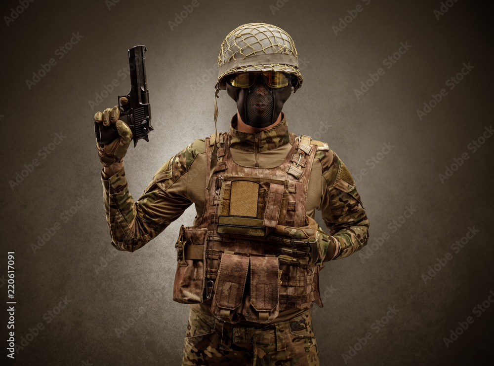 Soldier agent in a dark room with arms on his hand and gas mask
Soldier agent in a dark room with arms on his hand and gas mask